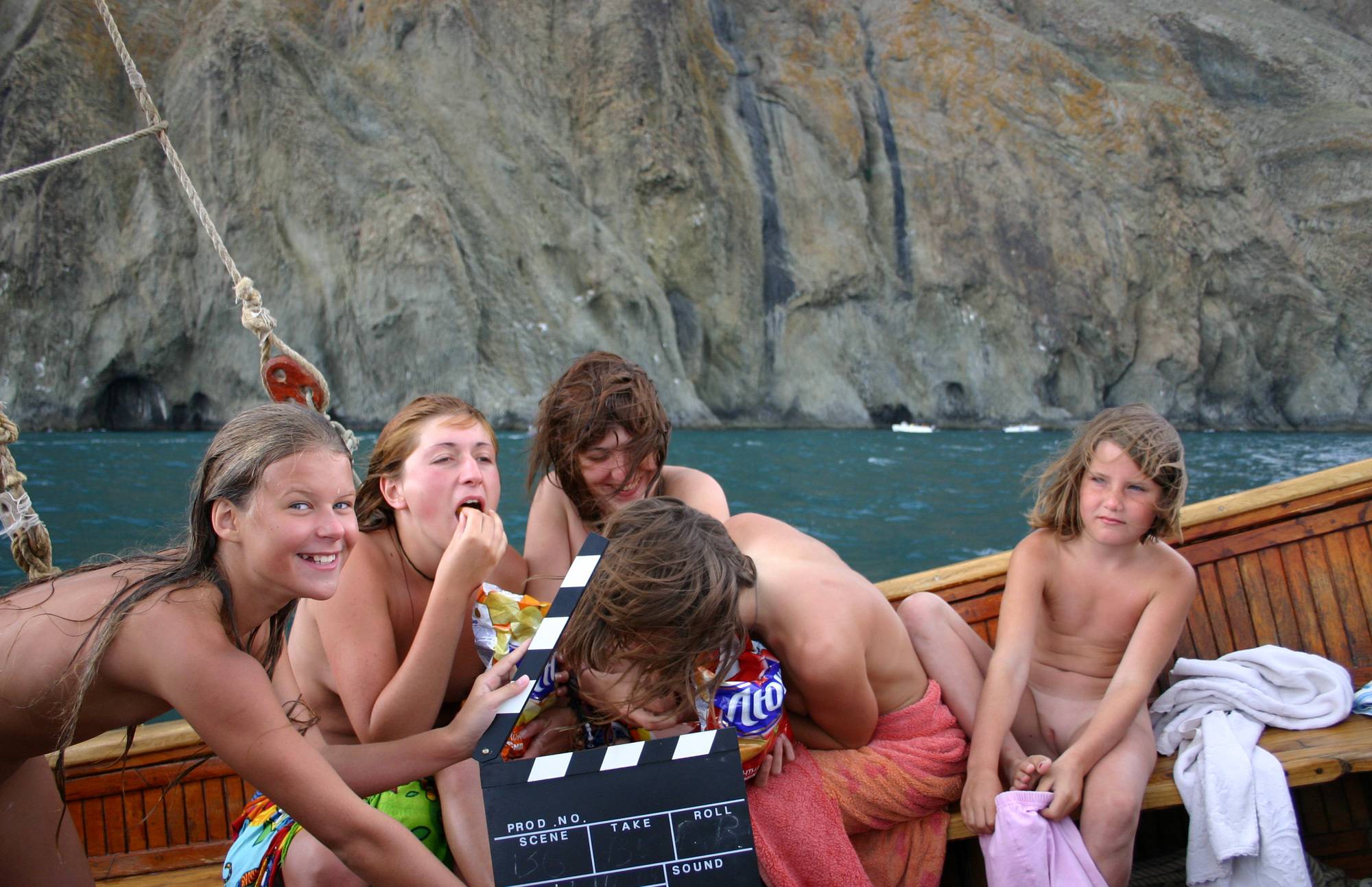 Group Snacking on Boat Nudist Pictures - 2